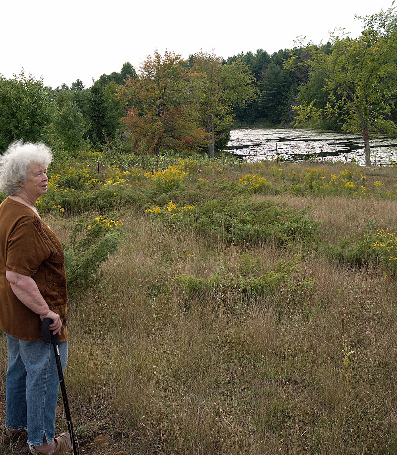 Hedy Muysson looking over her pond in 2011