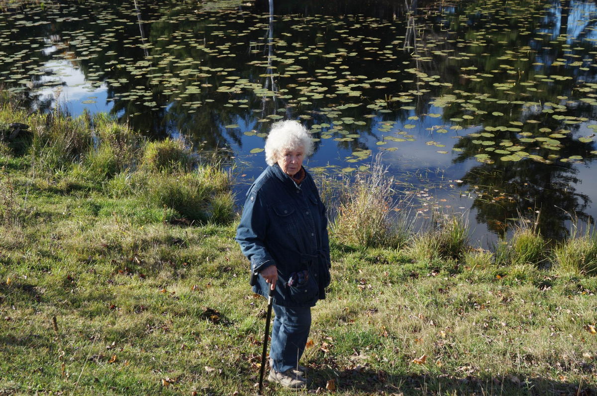 Hedy Muysson by her pond in 2014